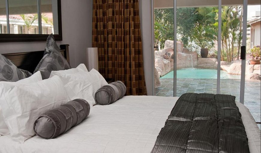 Pool View: Pool View with a queen size bed.
