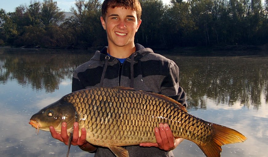 Fishing campsite on riverbank: Fishing