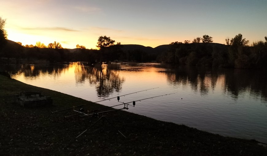 Fishing campsite on riverbank: Nature / fishing