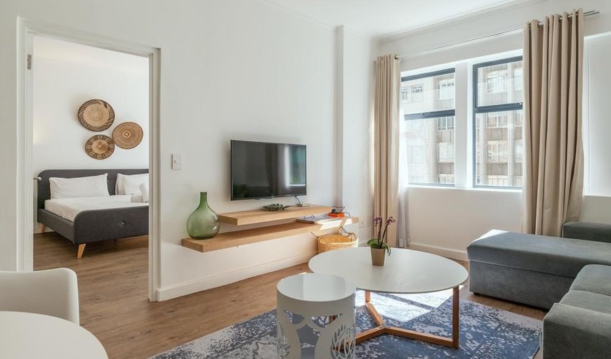 The apartment offers an open plan lounge, dining and kitchen area