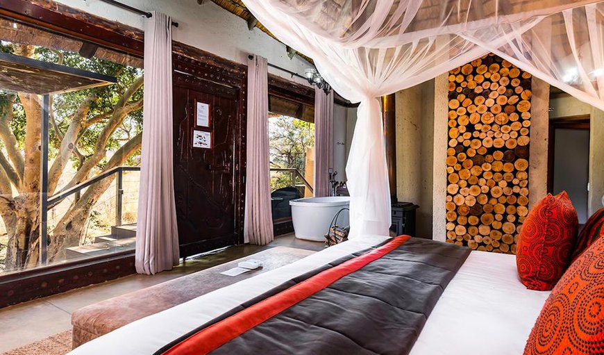 River Lodge Thatched Suites: River Lodge Thatched Suites - This bedroom is furnished with a king size bed