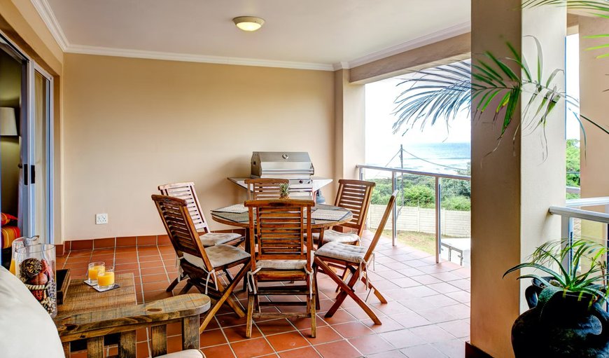 Balcony with a braai and dining table