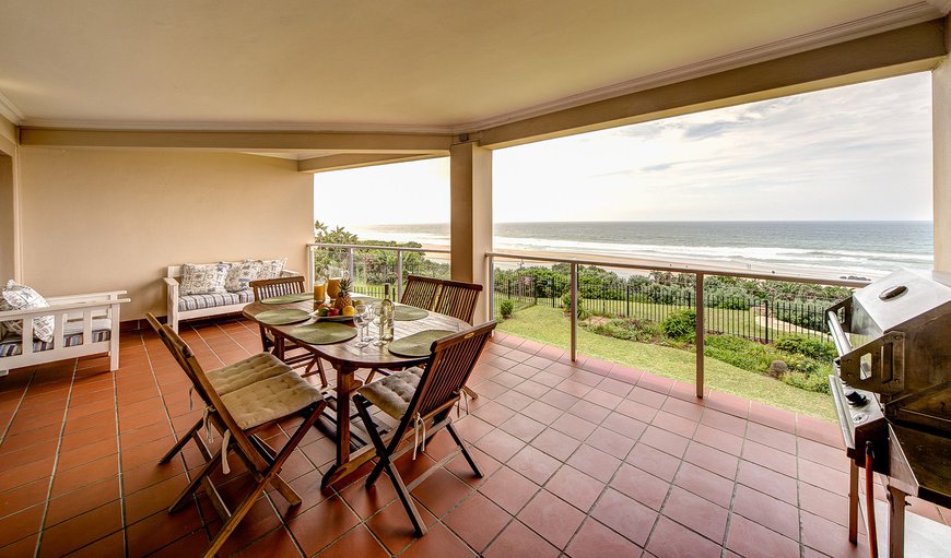 Wide terrace with 180 degree sea-view, outdoor furniture and a gas barbeque.