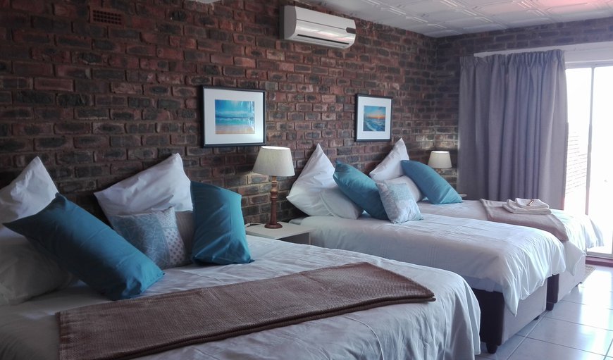 Ocean View Family Room: Ocean View family sleeper room has a king-size bed and 2 single beds. The room is also equipped with a Fridge, a TV with full DSTV channels, Hairdryer, Air-Con and Tea- and Coffee-making facilties.