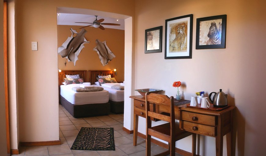 Twin Room - Africa: Africa bedroom with two single beds. Both rooms offer TV, tea & coffee trays, heater, hairdryers, safes and exclusive showers / WC en-suite.